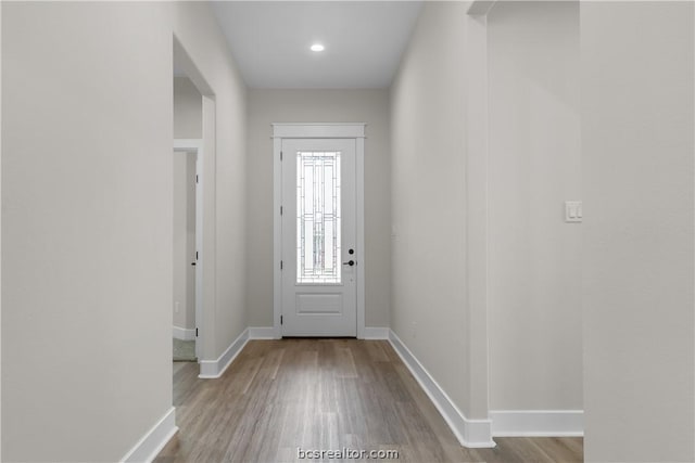 doorway with light hardwood / wood-style flooring