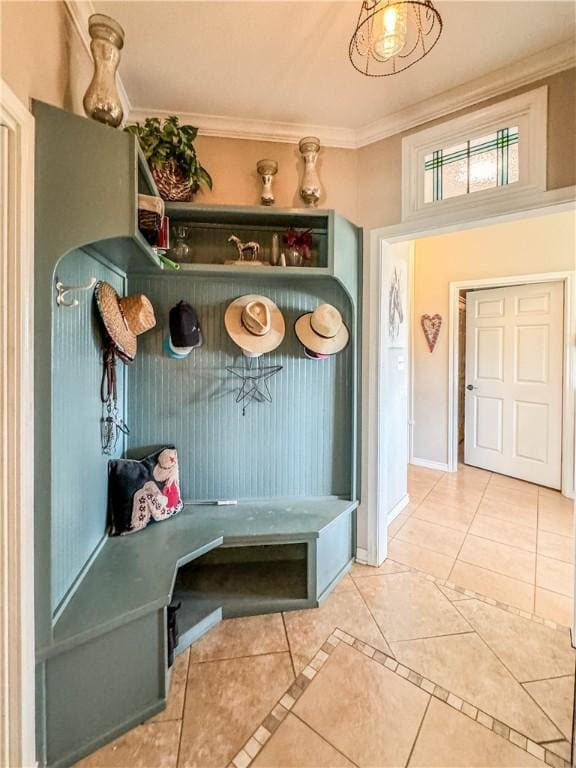 mudroom featuring tile patterned flooring and ornamental molding