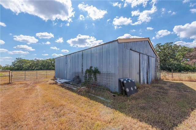 view of outbuilding featuring a rural view