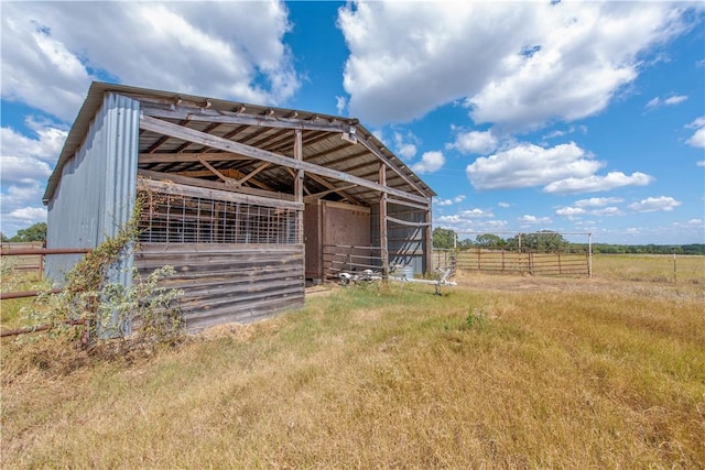 view of stable featuring a rural view