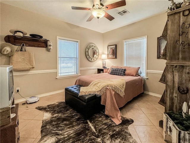 bedroom featuring ceiling fan and light tile patterned floors