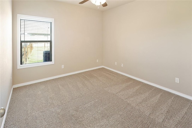 spare room featuring carpet and ceiling fan