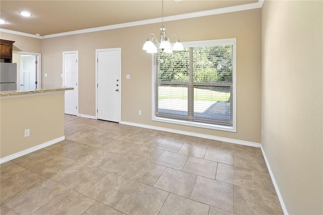 unfurnished dining area featuring crown molding and a notable chandelier