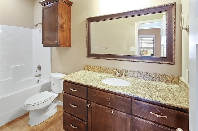 full bathroom featuring shower / tub combination, vanity, and toilet