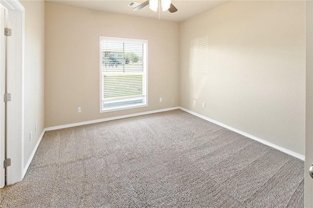 carpeted empty room featuring ceiling fan