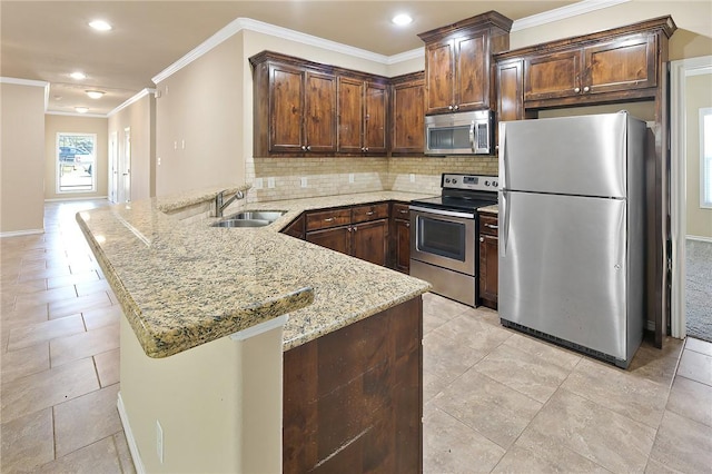 kitchen featuring crown molding, sink, light stone countertops, kitchen peninsula, and stainless steel appliances