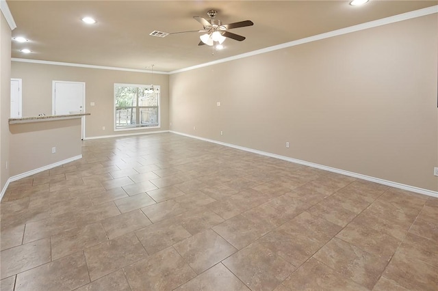 spare room featuring ceiling fan and crown molding