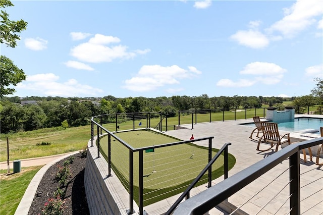 exterior space featuring a pool and a patio