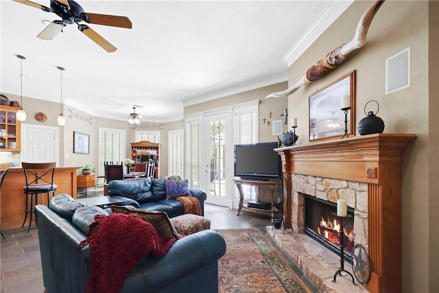 4304 Newcastle Ct, Bryan, TX 77802 - living area featuring crown molding, a fireplace, and a ceiling fan