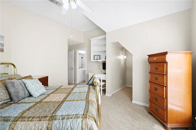 4304 Newcastle Ct, Bryan, TX 77802 - bedroom featuring visible vents, light carpet, baseboards, ensuite bathroom, and ceiling fan
