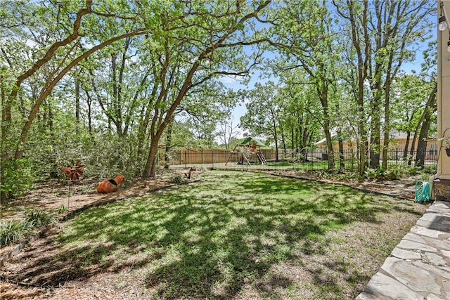 4304 Newcastle Ct, Bryan, TX 77802 - view of yard featuring a fenced backyard and a playground