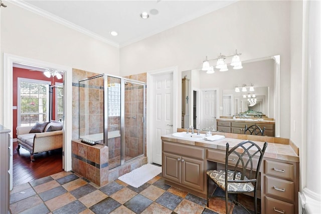 4304 Newcastle Ct, Bryan, TX 77802 - bathroom featuring a shower stall, ornamental molding, ensuite bathroom, and vanity