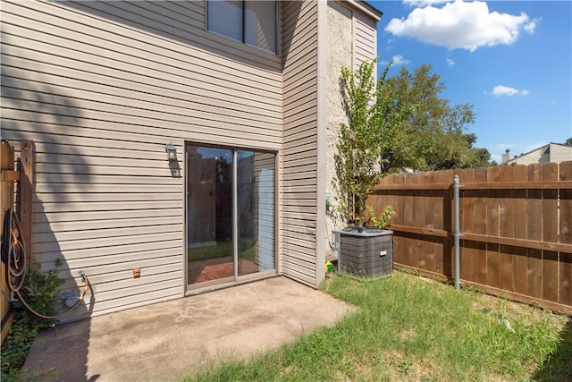 exterior space featuring cooling unit and a patio