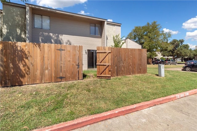 view of side of property with a lawn