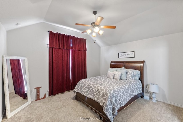 carpeted bedroom featuring ceiling fan and lofted ceiling