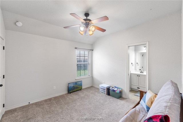 living area featuring light carpet, ceiling fan, and sink