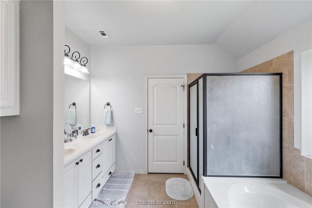 bathroom with tile patterned floors, vanity, lofted ceiling, and shower with separate bathtub