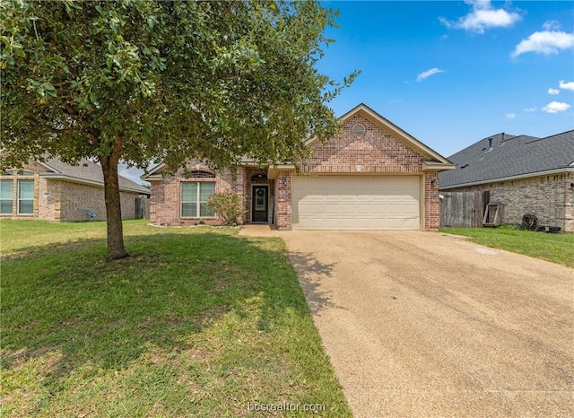 view of front of property featuring a garage and a front lawn