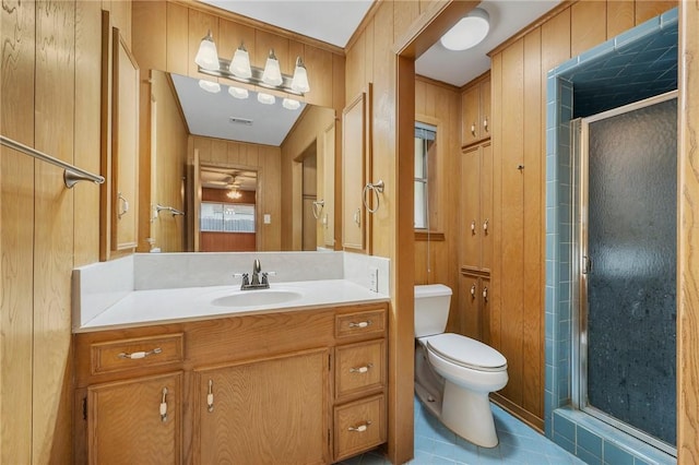 bathroom featuring a stall shower, toilet, and vanity