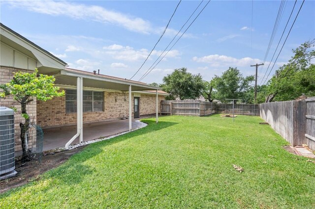 view of yard with a patio area and central AC