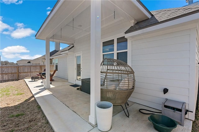 view of patio / terrace featuring fence