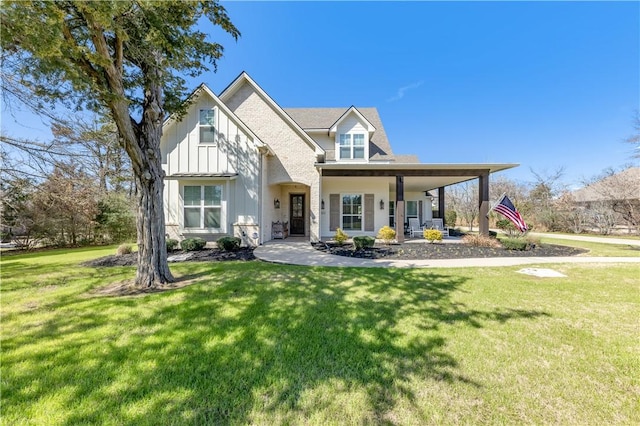 view of front of home featuring a front lawn and board and batten siding