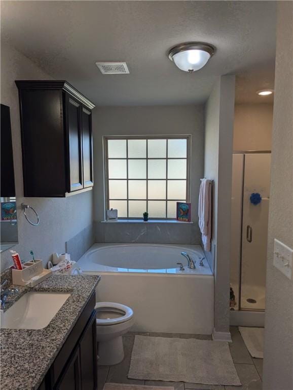 full bathroom with tile patterned floors, vanity, toilet, and shower with separate bathtub