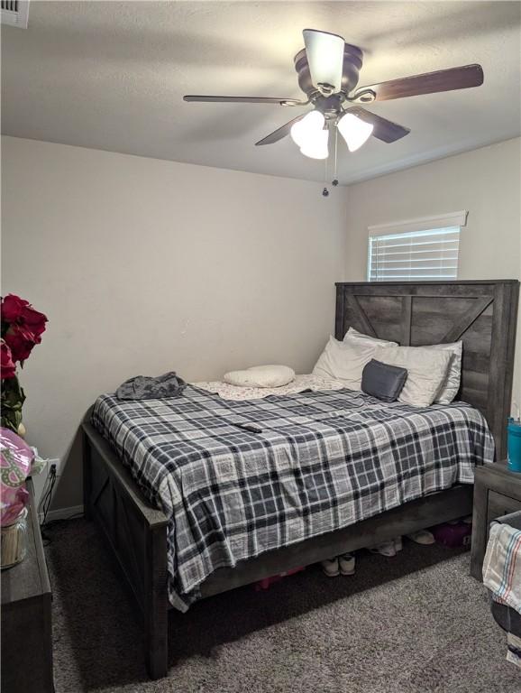 carpeted bedroom featuring ceiling fan