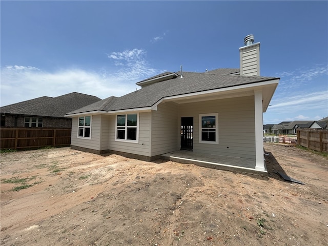 3056 Teller Dr, Bryan, TX 77808 - rear view of house featuring a chimney