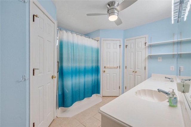 bathroom with ceiling fan, tile patterned floors, shower / bath combo, and vanity