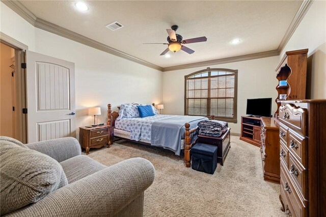 bedroom featuring visible vents, light colored carpet, and ornamental molding