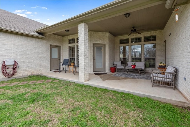 view of patio / terrace with an outdoor living space and ceiling fan