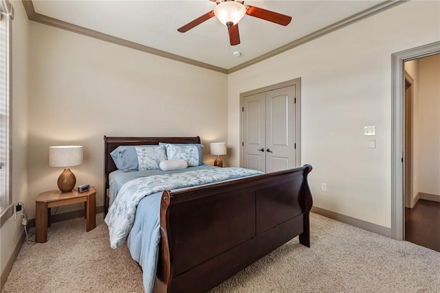 bedroom with light carpet, crown molding, and baseboards