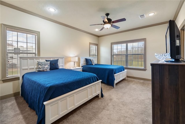 carpeted bedroom with recessed lighting, visible vents, baseboards, and crown molding