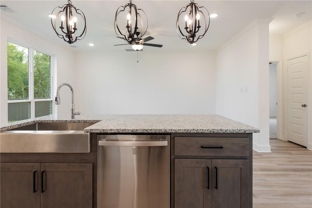 kitchen with light stone countertops, light wood-type flooring, stainless steel dishwasher, ornamental molding, and sink