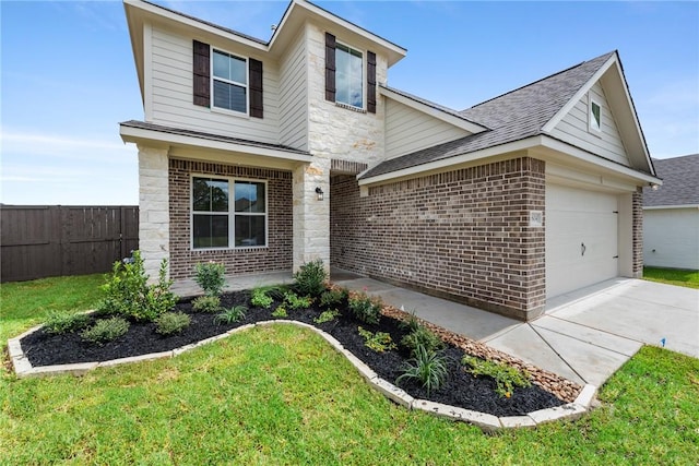 view of front facade with a front lawn and a garage