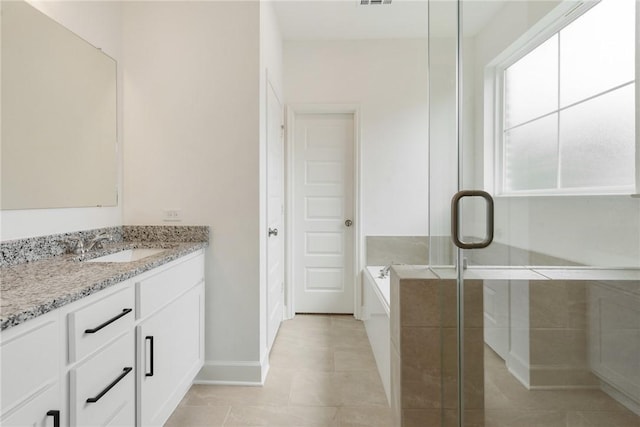 bathroom featuring tile patterned floors, vanity, and independent shower and bath