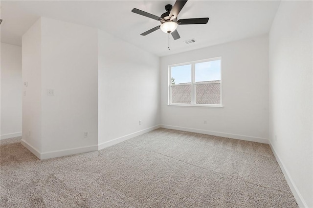 carpeted empty room with ceiling fan