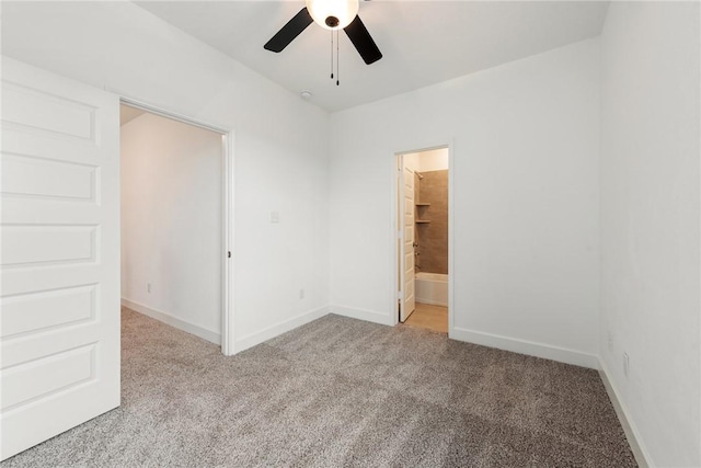 spare room featuring ceiling fan and light carpet