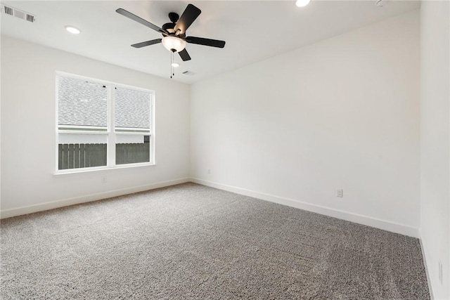 empty room with carpet flooring and ceiling fan