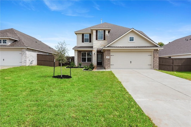 view of front of property with a front yard and a garage