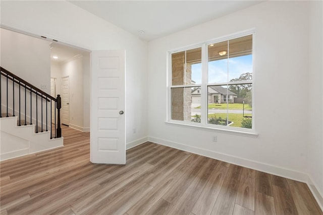 empty room with hardwood / wood-style floors