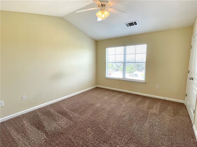 carpeted spare room with lofted ceiling and ceiling fan