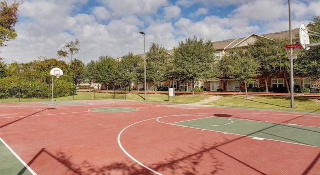 view of sport court featuring a yard