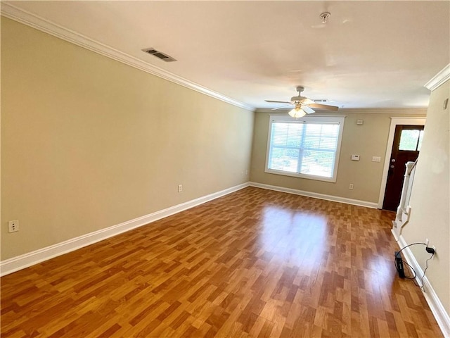 unfurnished room with ceiling fan, ornamental molding, and hardwood / wood-style floors