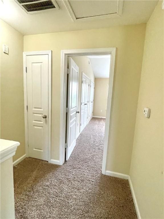 corridor featuring carpet flooring