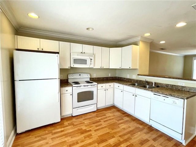 kitchen featuring white cabinetry, ornamental molding, sink, and white appliances