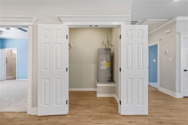 utility room with electric water heater