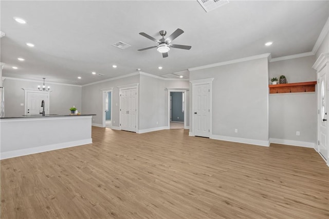 unfurnished living room featuring ceiling fan with notable chandelier, light hardwood / wood-style flooring, and ornamental molding