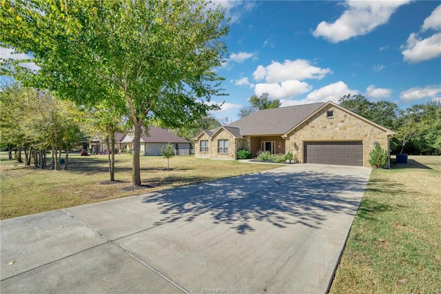 ranch-style home with a garage and a front yard